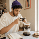 Mateo, 26, creative director, photographing a pour-over for Instagram